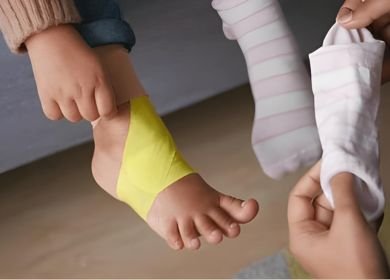 Kinesio taping technique applied to feet ankle for support and relief
